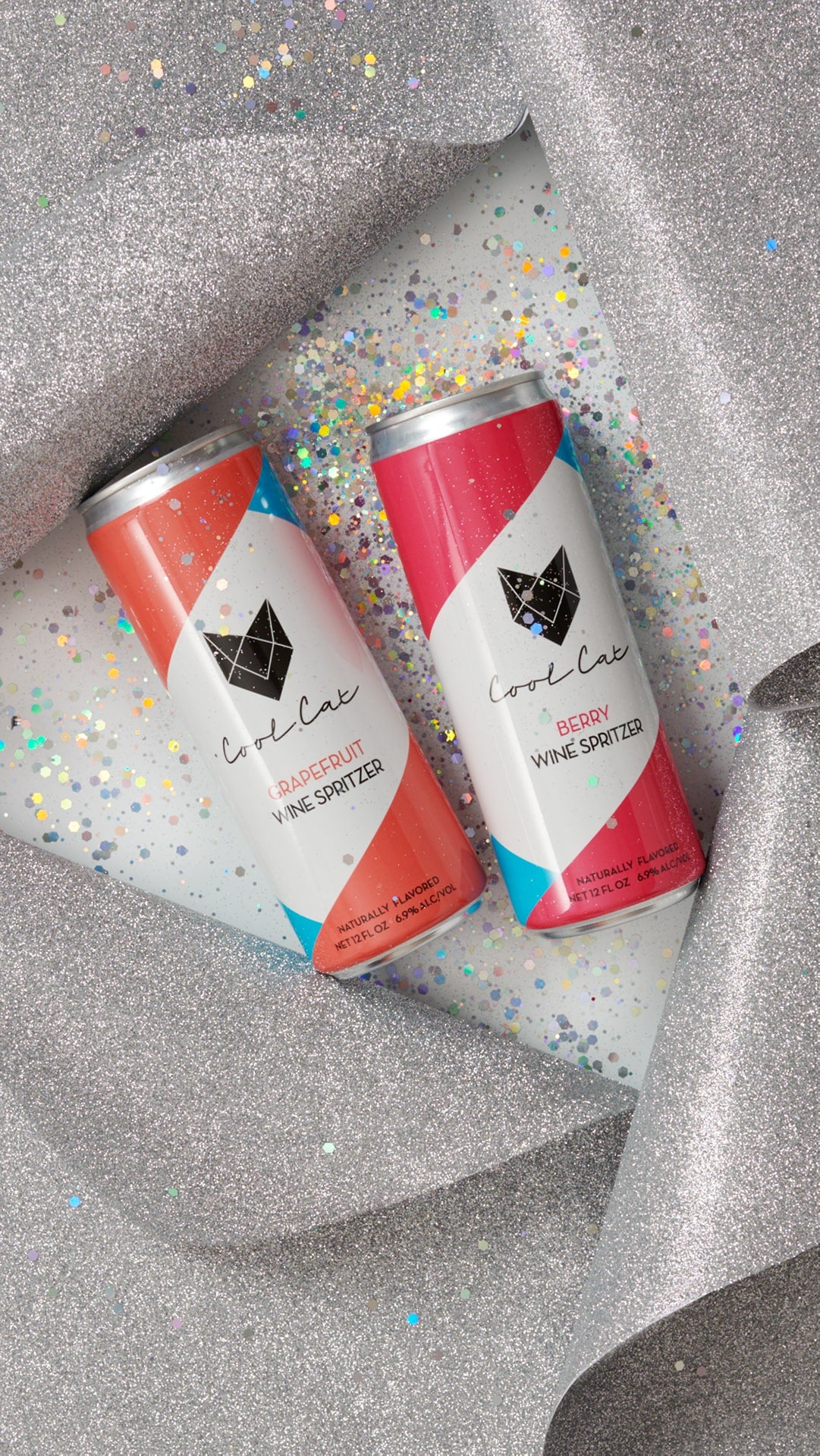 Two cans of Cool Cat cocktail in wrapping paper.
